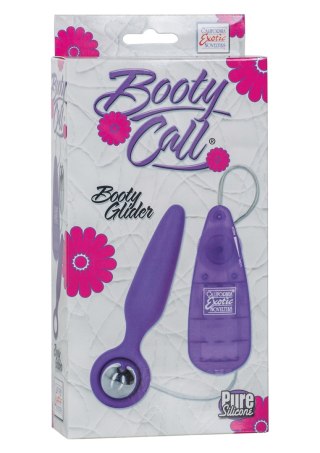 Wibrujący korek analny Booty Call Booty Glider fioletowy 9.5 cm